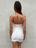 Abito bianco con gioiello push up