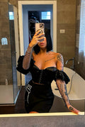 Top nero con maniche in strass