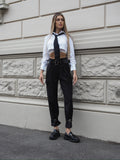 Pantalone nero con cinghie