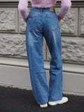 Jeans vita bassa con strappi