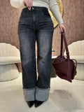 Jeans con risvolto e strass