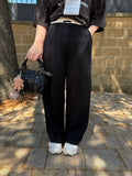 Pantalone nero banda beige