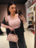 Top in pizzo con bottoni gioiello