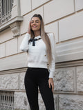 Maglione panna con fiocco nero