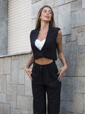 Completo smanicato e pantalone gessato nero