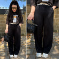 Pantalone nero banda beige