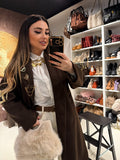 Cappotto con fodera animalier e spille
