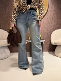 Jeans con borchie e dettaglio maculato sul retro