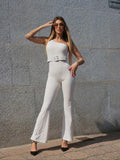 Tuta monospalla beige con cintura