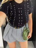 Maglioncino crop nero a trecce con strass