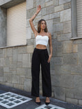 Completo smanicato e pantalone gessato nero
