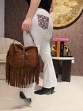 Jeans con tasca glitter maculata