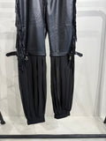 Pantalone in ecopelle con frange