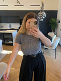 Maglioncino crop grigio a trecce con strass