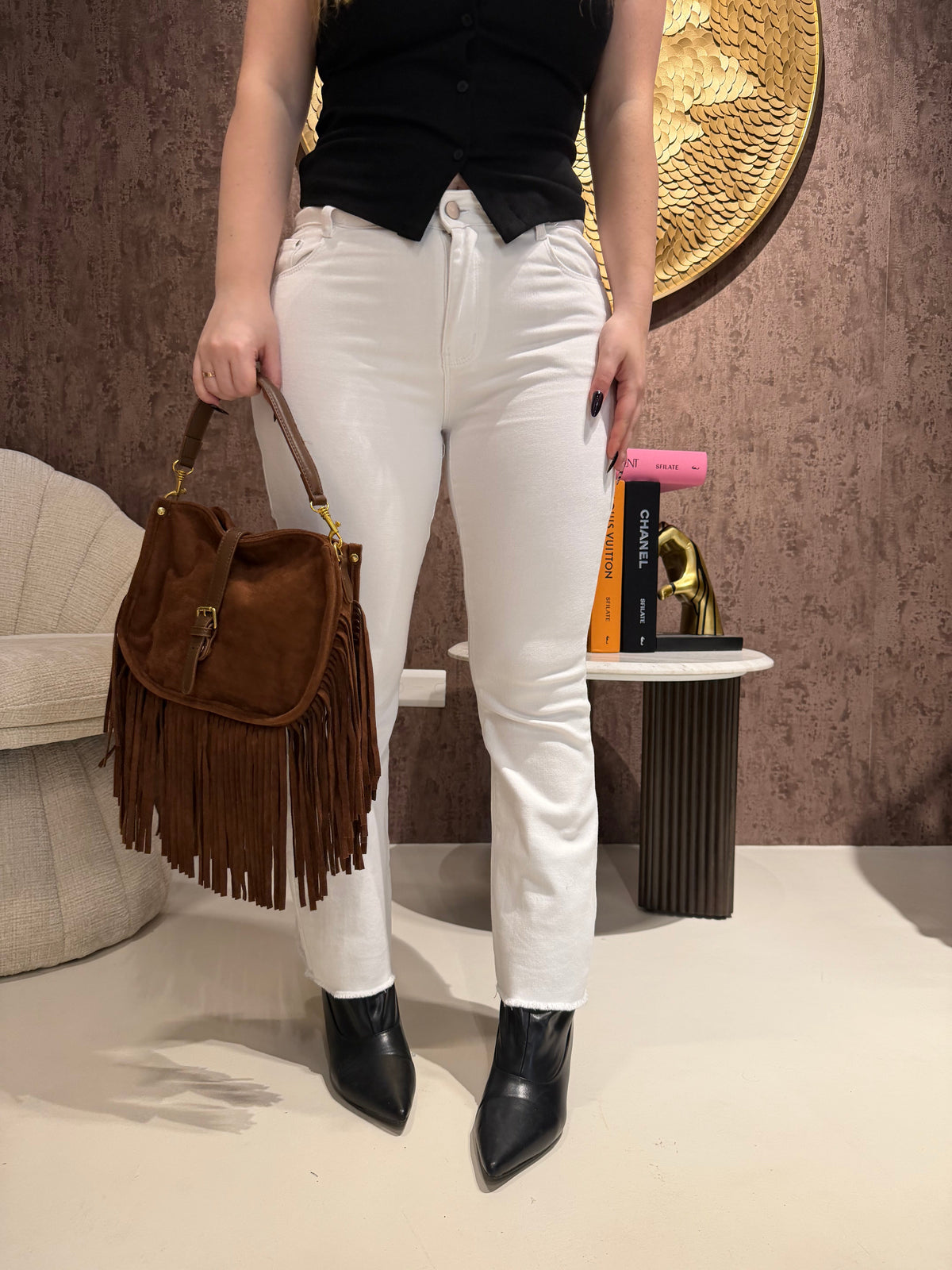 Jeans con tasca glitter maculata