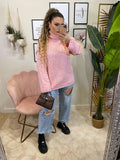 Maglione rosa con lacci bianchi