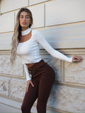 Pantalone choco con cintura oro