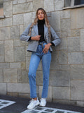 Giacca grigia con bottoni oro