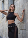 Completo top e gonna nero con trasparenze