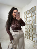 Pantalone con fibbia laterale
