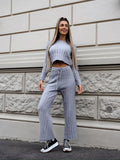 Completo maglia e pantalone grigio a righe