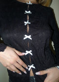 Maglia nera con fiocchetti