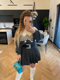 Maglione grigio con maxi paillettes