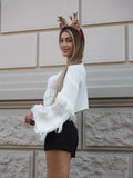 Maglione bianco con frange