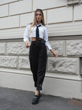 Pantalone nero con cinghie