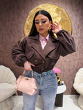 Trench con elastico