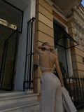 Set tre pezzi camicia top e pantalone beige