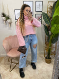 Maglione rosa con lacci bianchi