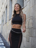 Completo top e gonna nero con trasparenze