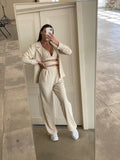 Set tre pezzi camicia top e pantalone beige