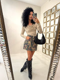 Maglia a maniche lunghe con scollo drappeggiato