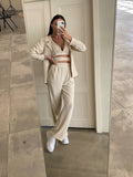 Set tre pezzi camicia top e pantalone beige