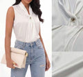 Blusa con gioiello