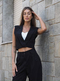 Completo smanicato e pantalone gessato nero