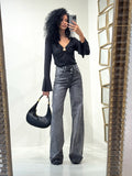 Jeans scuro con strass e risvolto