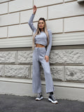 Completo maglia e pantalone grigio a righe