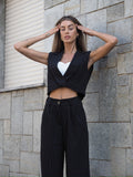 Completo smanicato e pantalone gessato nero