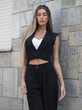 Completo smanicato e pantalone gessato nero