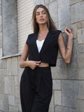 Completo smanicato e pantalone gessato nero