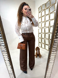 Pantalone con fibbia laterale