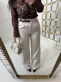 Pantalone con fibbia laterale