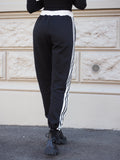 Pantalone sportivo con righe bianche