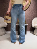 Jeans con borchie e dettaglio maculato sul retro