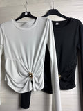 Maglia con fiocco e gioiello oro