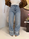 Jeans con risvolto e strass