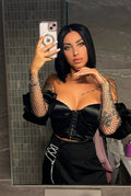 Top nero con maniche in strass